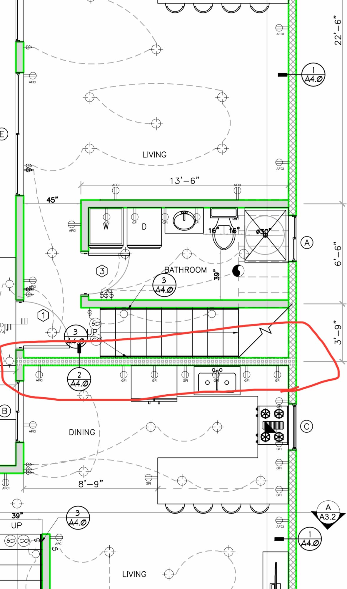 Construction floor plan with electrical layout, cabinets and a redlined revision