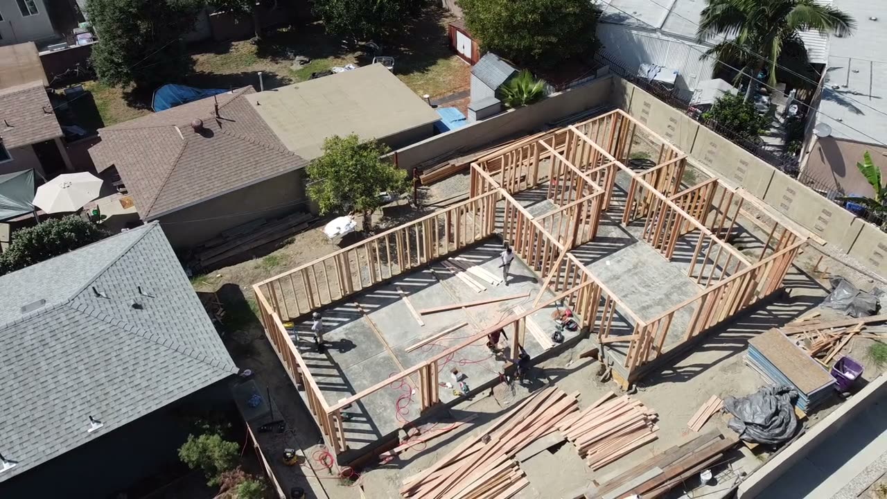 Drone view of a home addition in framing