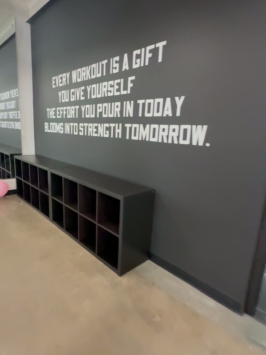 Quote wall and cubbies outside the studio