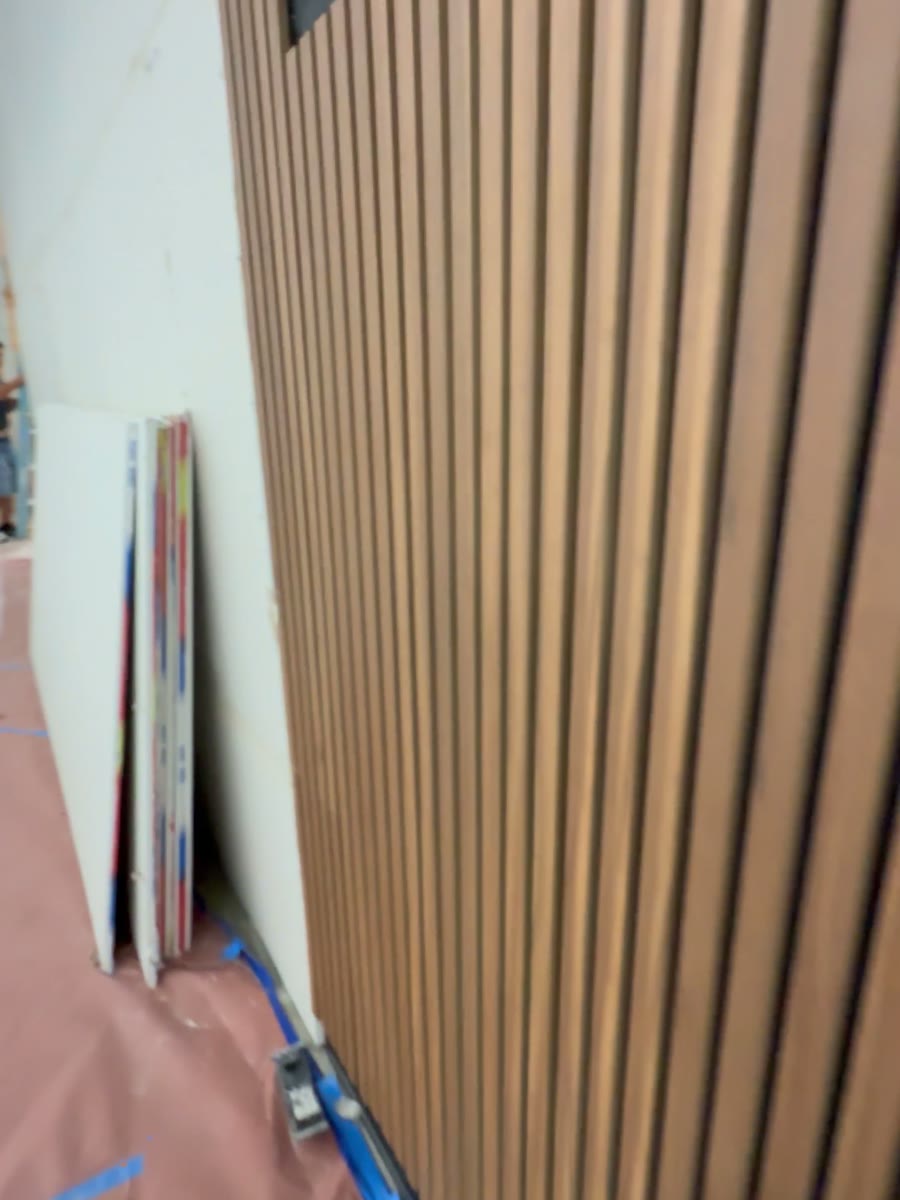 Wood slat wall along the corridor