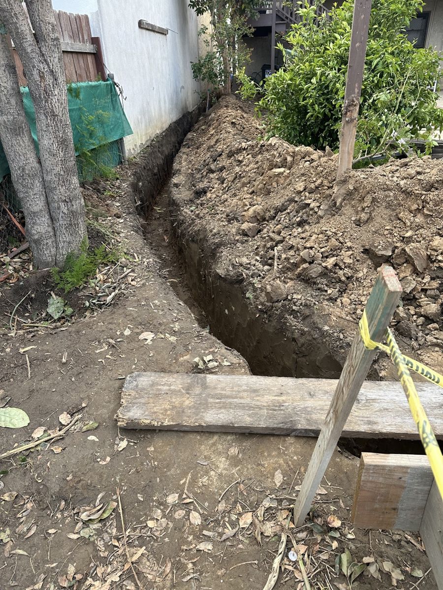 Utility trench along the side yard