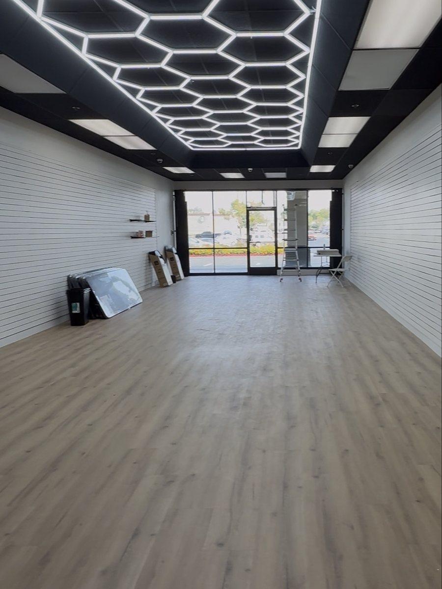 Looking to the storefront under the hex lights