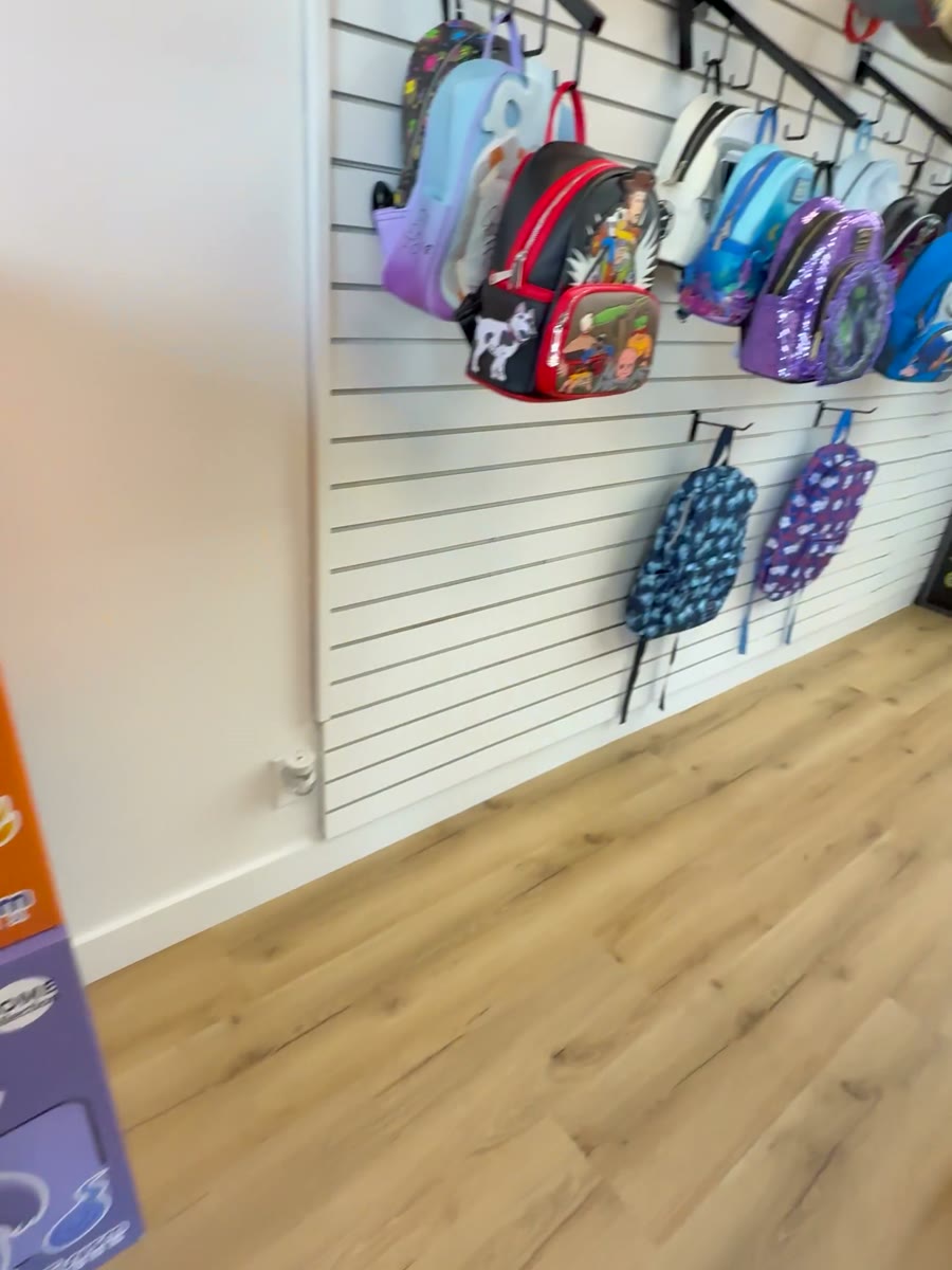 Backpacks and merchandise on the slatwall