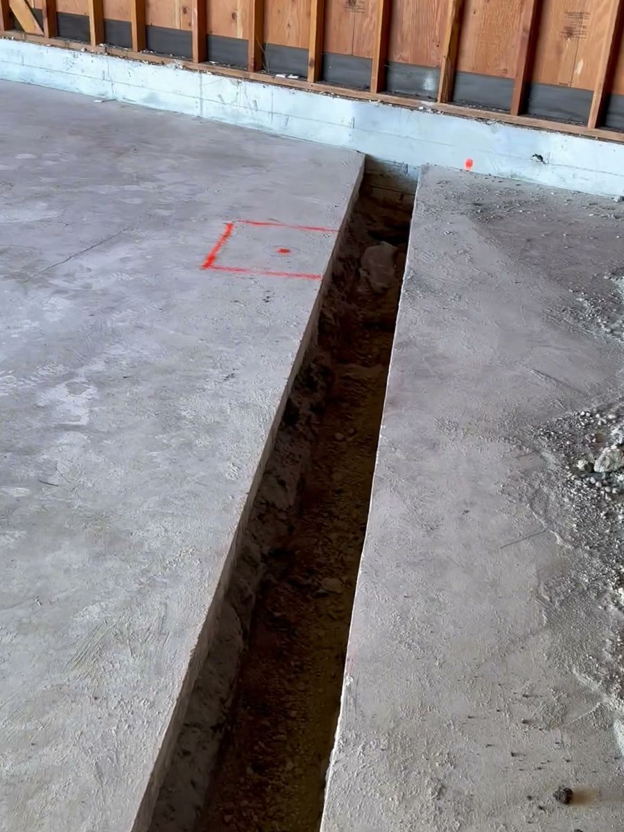 Trench for new drain lines