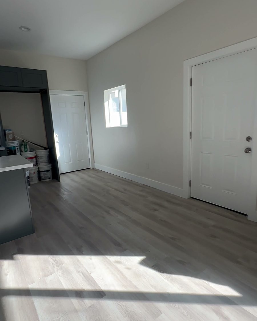 After: the finished living area with new flooring