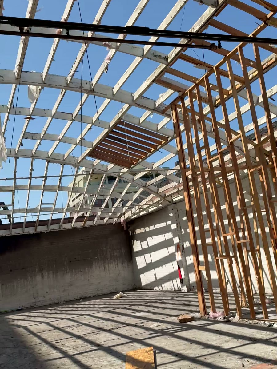 Roof framing and wall framing going in