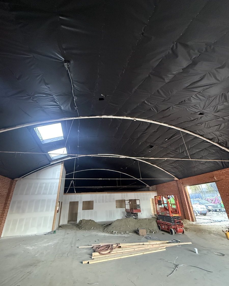 The rebuilt warehouse interior with new roof, skylights and new interior walls