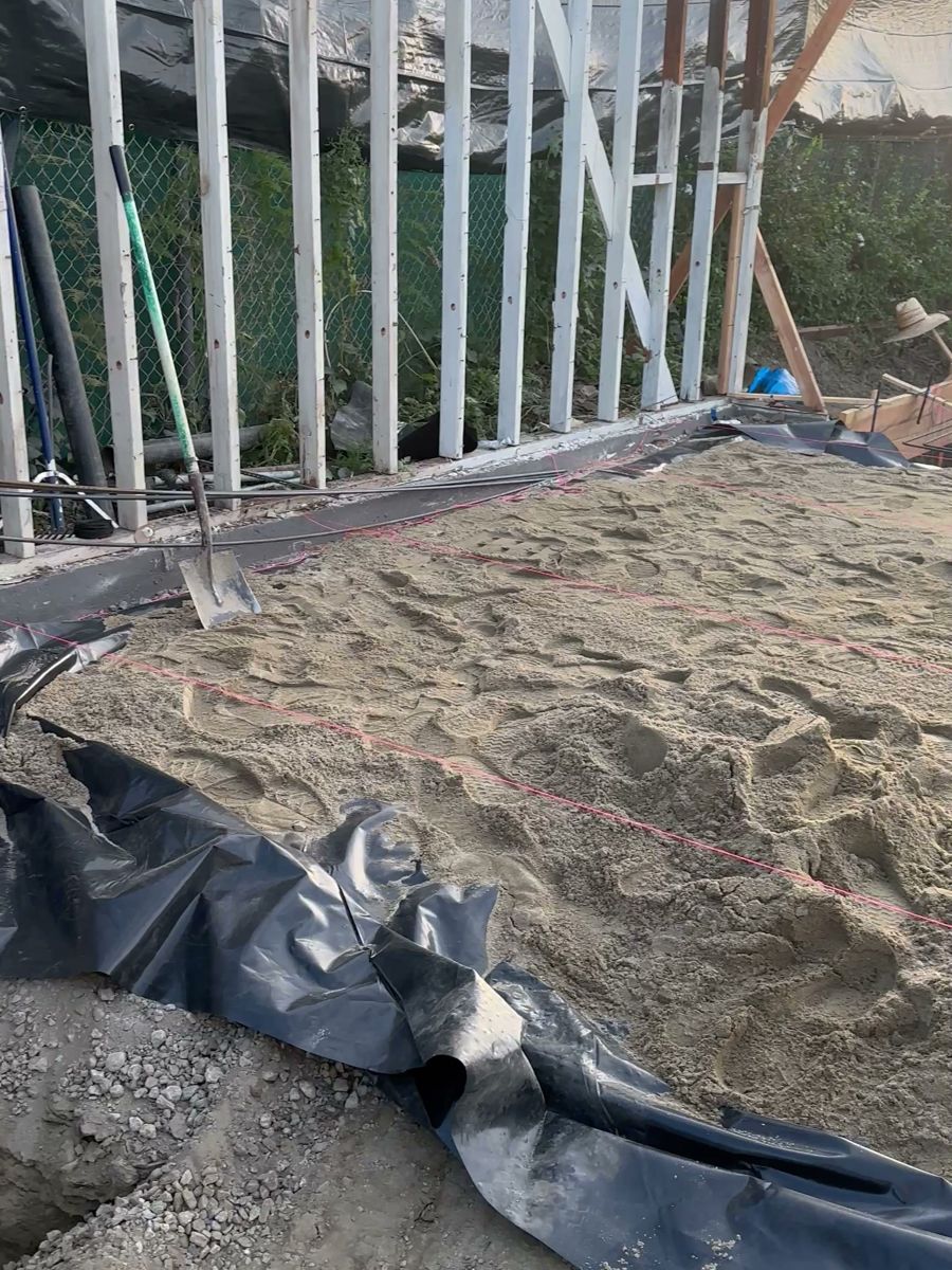 Vapor barrier and sand base
