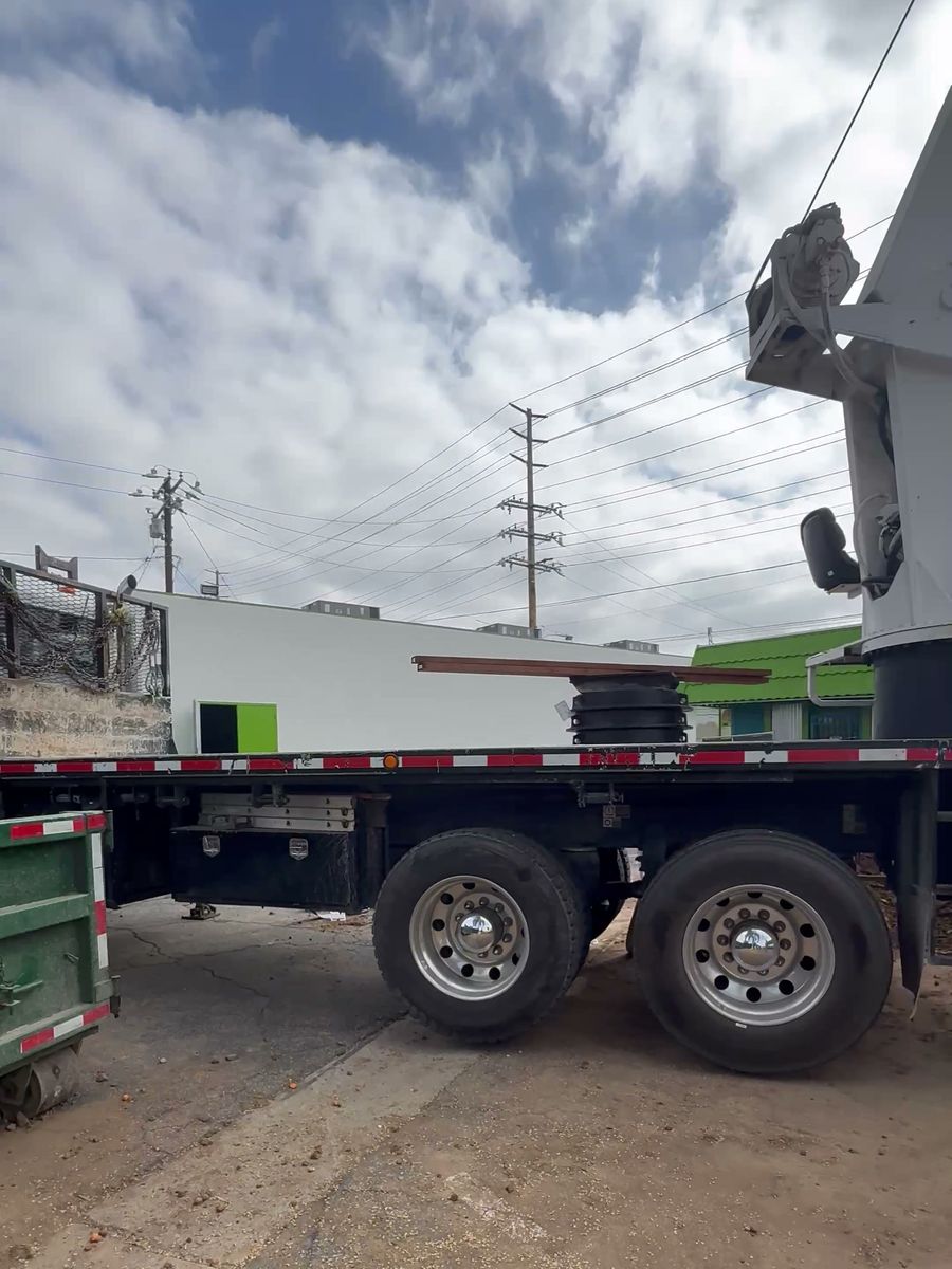 Crane truck staged in the parking lot