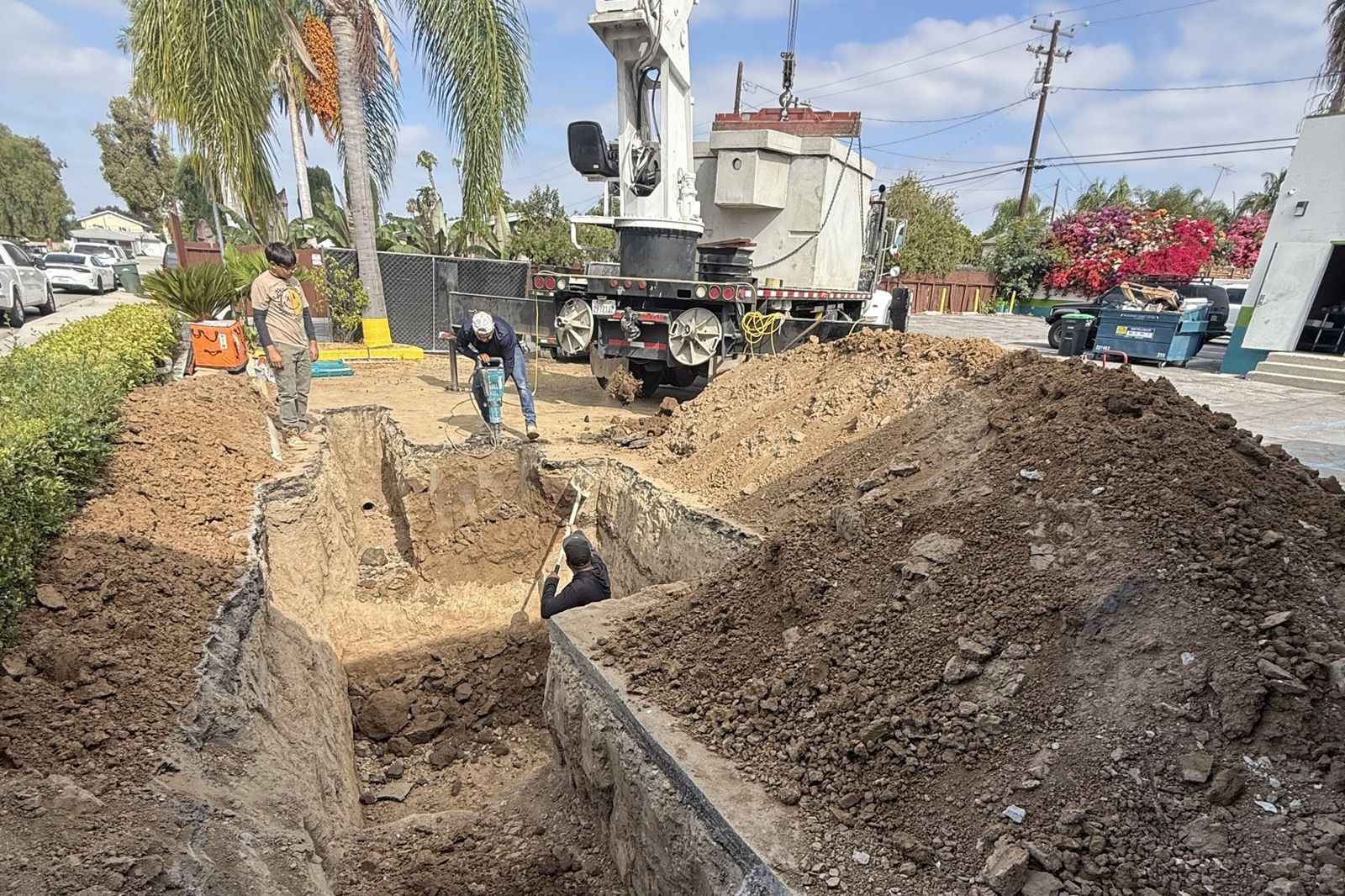 Crane setting a grease interceptor at Miches de la Baja