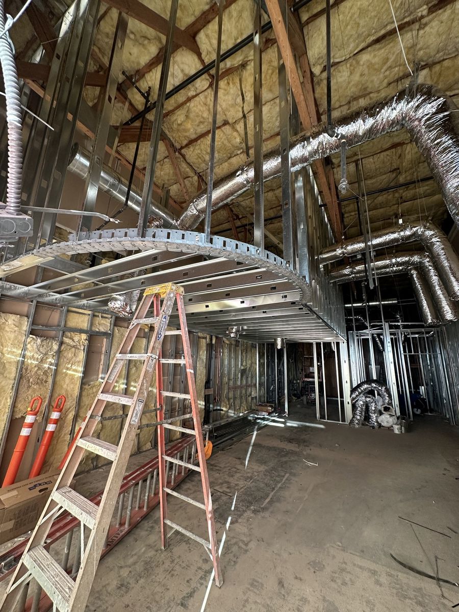 Curved ceiling soffits during the Movita Juice Bar build-out