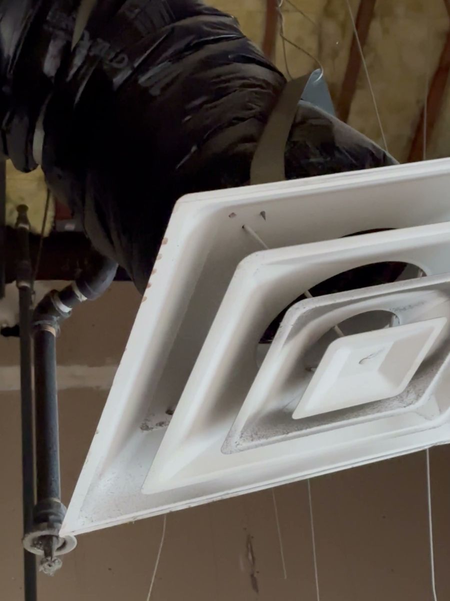 New HVAC diffuser in a commercial ceiling