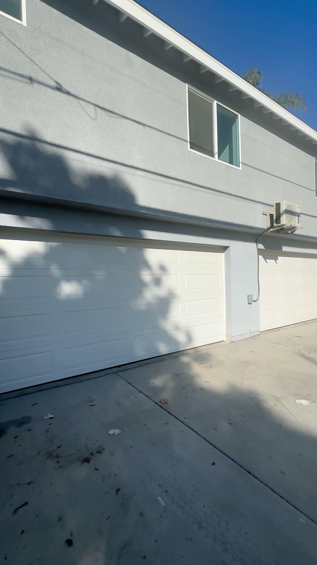 Roll-up garage doors and smooth stucco